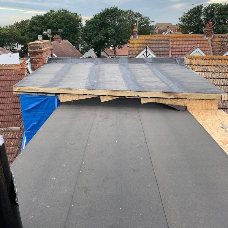 Flat roof deck being felted on a rear extension in Lancing