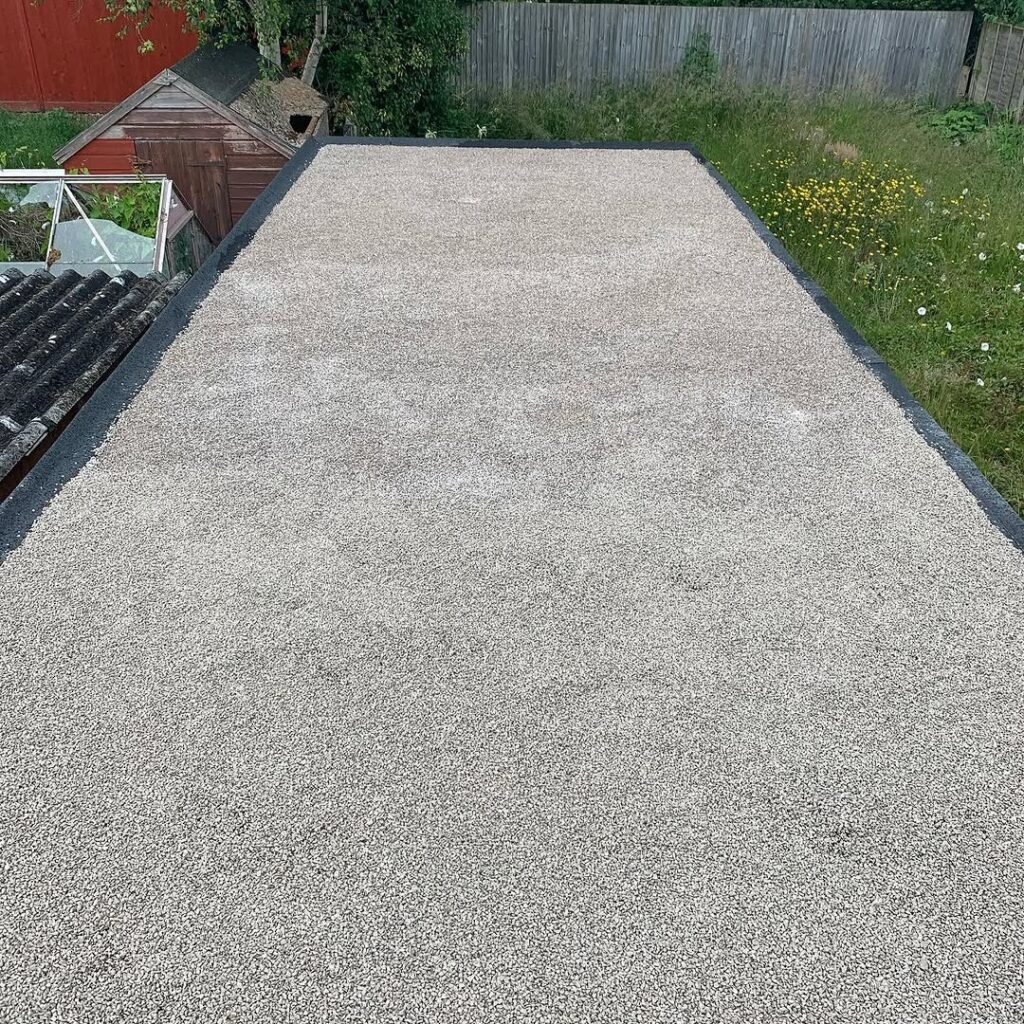 GRP fibreglass flat roof with mineral finish on a garage in Lancing
