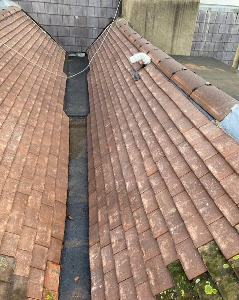 Lead lined valley between two tiled roofs in Lancing
