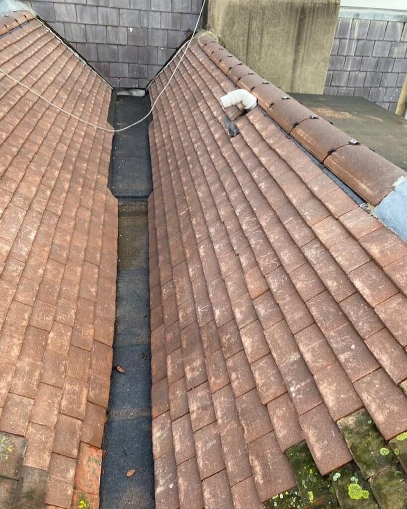 Lead lined valley between two tiled roofs in Lancing
