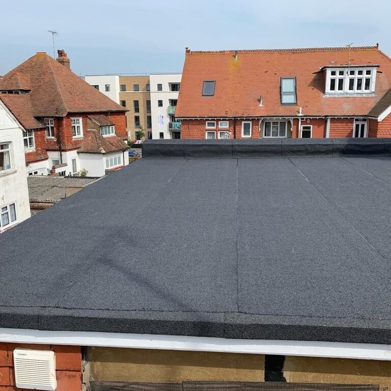 New felt flat roof on a rear extension in Worthing with sea views behind