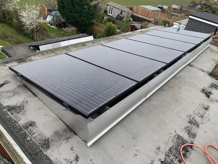 Roof work around solar panels on a flat roof in Lancing