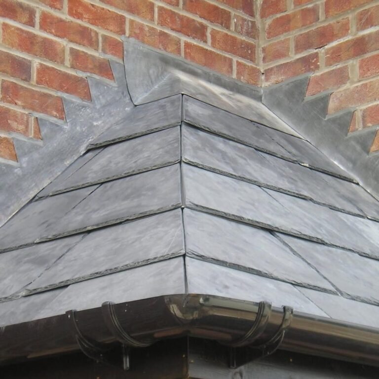 Slate hip with lead soakers and new guttering on a house in Worthing