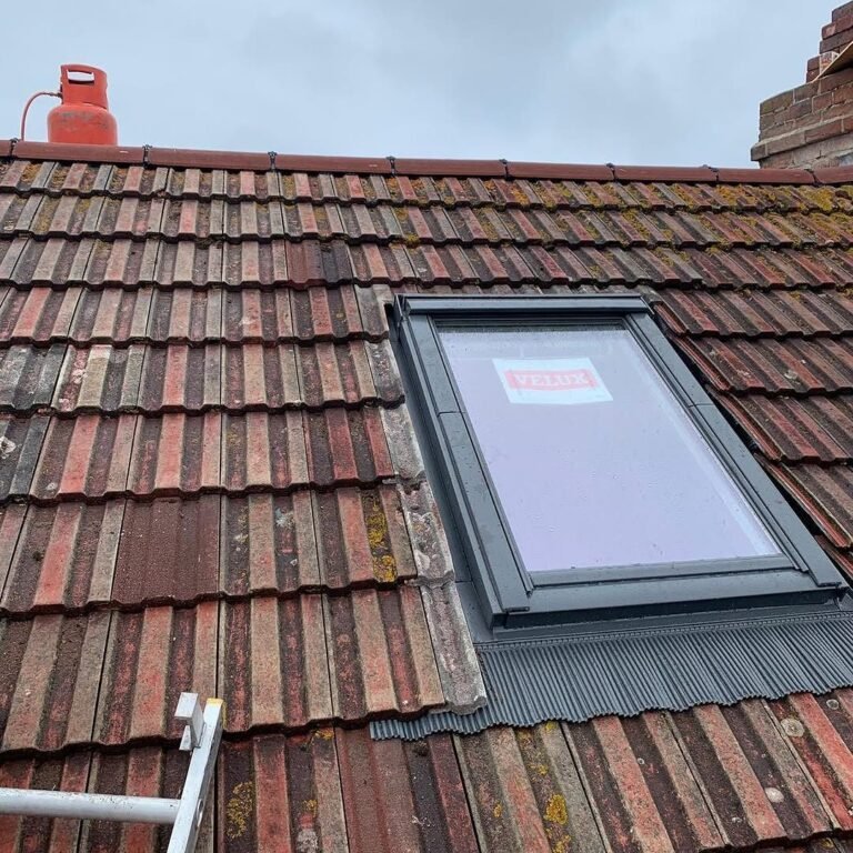 Velux roof window fitted into a tiled roof in Shoreham-by-Sea